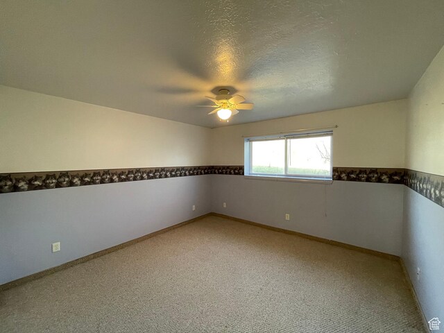 848 N 500 W, Malad City, ID 83252 - spare room featuring light carpet, baseboards, a textured ceiling, and ceiling fan