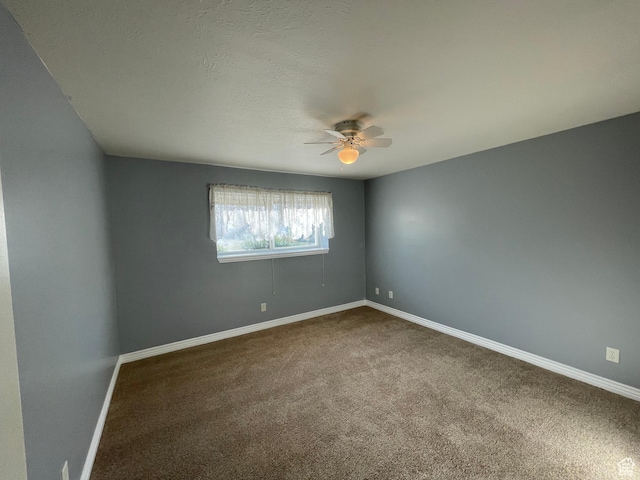 848 N 500 W, Malad City, ID 83252 - unfurnished room with ceiling fan, dark colored carpet, and baseboards