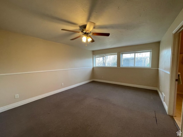 848 N 500 W, Malad City, ID 83252 - spare room with dark colored carpet, baseboards, a textured ceiling, and ceiling fan