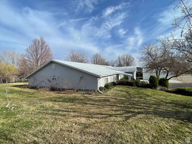 848 N 500 W, Malad City, ID 83252 - view of side of property featuring metal roof and a lawn