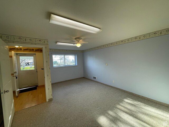 848 N 500 W, Malad City, ID 83252 - unfurnished room featuring carpet flooring, visible vents, baseboards, and a ceiling fan