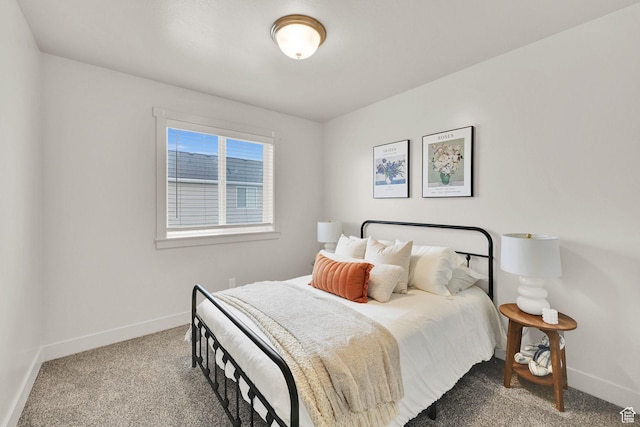 carpeted bedroom with baseboards