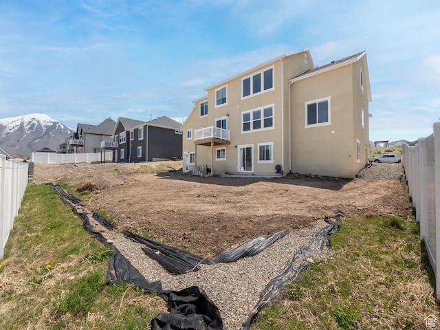 572 W Goosenest Dr, Elk Ridge, UT 84651 - rear view of property with stucco siding and a balcony