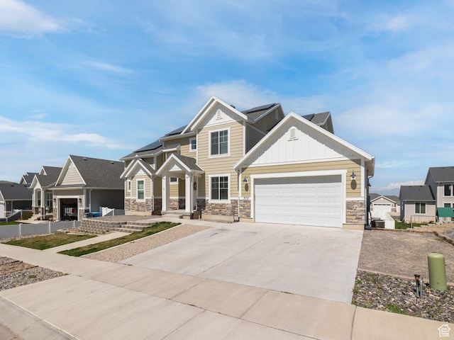 572 W Goosenest Dr, Elk Ridge, UT 84651 - craftsman house featuring stone siding, board and batten siding, driveway, a residential view, and covered porch