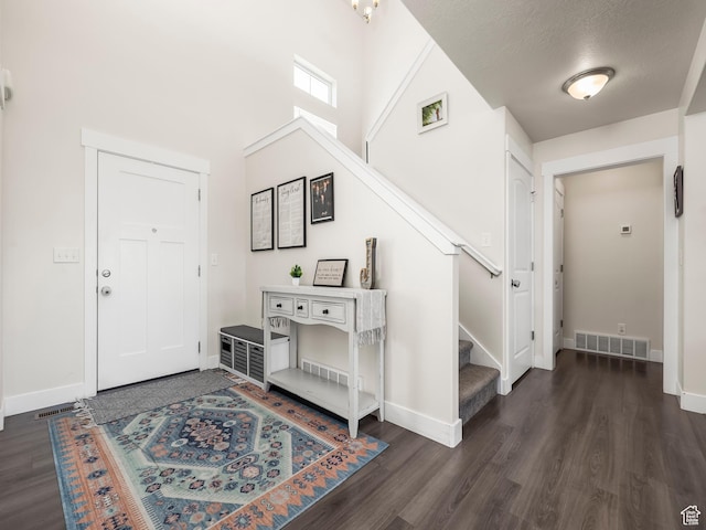 572 W Goosenest Dr, Elk Ridge, UT 84651 - foyer featuring dark wood-style flooring, stairs, baseboards, and a high ceiling
