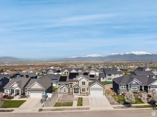572 W Goosenest Dr, Elk Ridge, UT 84651 - view of front of property with stone siding, a residential view, a garage, and concrete driveway