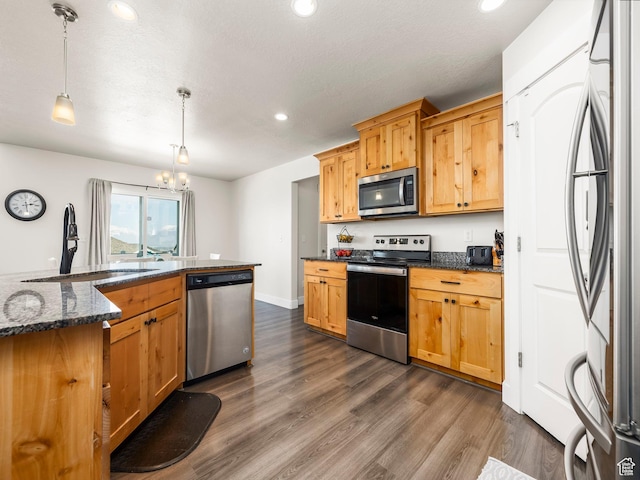 572 W Goosenest Dr, Elk Ridge, UT 84651 - kitchen with stainless steel appliances, a sink, dark wood-type flooring, recessed lighting, and pendant lighting