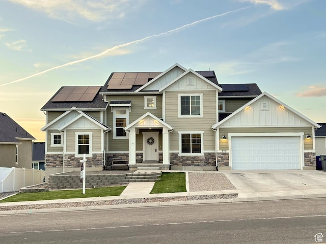 572 W Goosenest Dr, Elk Ridge, UT 84651 - craftsman-style house featuring board and batten siding, stone siding, and concrete driveway