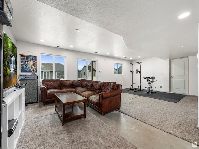 572 W Goosenest Dr, Elk Ridge, UT 84651 - living room featuring recessed lighting, a textured ceiling, and concrete floors
