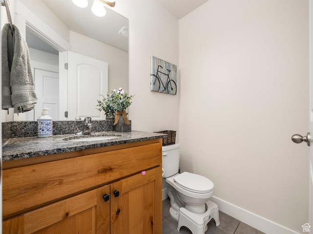 572 W Goosenest Dr, Elk Ridge, UT 84651 - half bathroom featuring tile patterned flooring, toilet, vanity, and baseboards