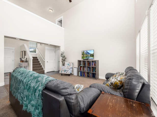 572 W Goosenest Dr, Elk Ridge, UT 84651 - living room featuring stairs, baseboards, and a high ceiling