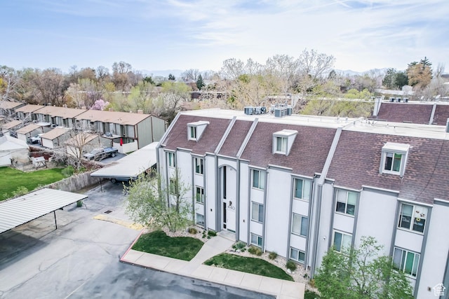 birds eye view of property with a residential view