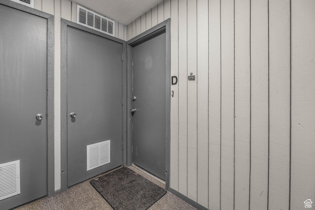 view of exterior entry with visible vents