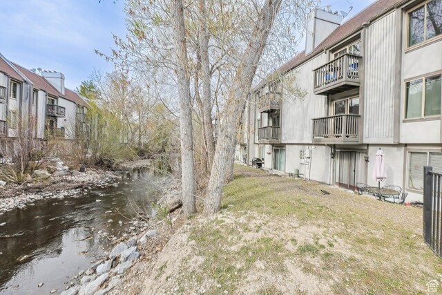 440 E Creekside Cir Unit D, Murray, UT 84107 - view of yard with a balcony and a water view