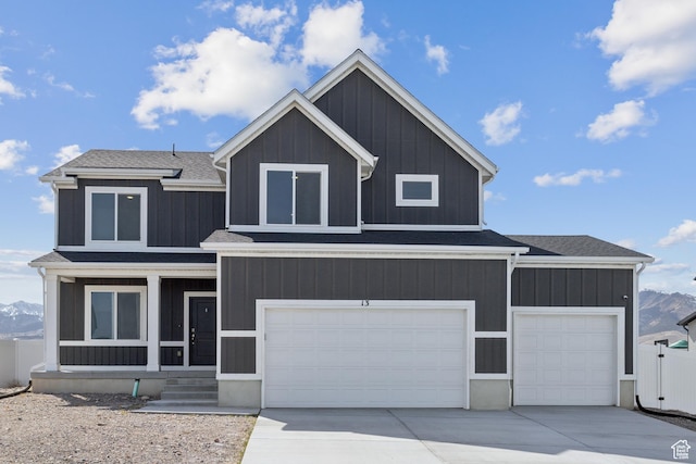 13 N N Maraschino Ln, Grantsville, UT 84029 - modern inspired farmhouse featuring a mountain view, a garage, driveway, and roof with shingles
