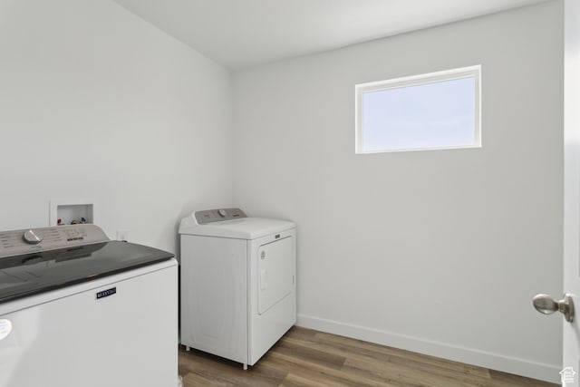 13 N N Maraschino Ln, Grantsville, UT 84029 - clothes washing area featuring independent washer and dryer, laundry area, wood finished floors, and baseboards