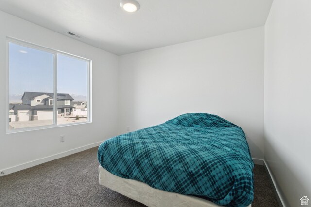 13 N N Maraschino Ln, Grantsville, UT 84029 - carpeted bedroom featuring baseboards and visible vents