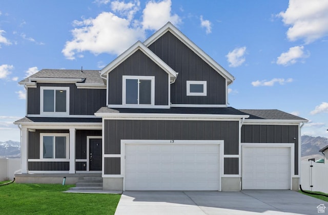 13 N N Maraschino Ln, Grantsville, UT 84029 - modern farmhouse featuring a shingled roof, an attached garage, fence, concrete driveway, and a front lawn