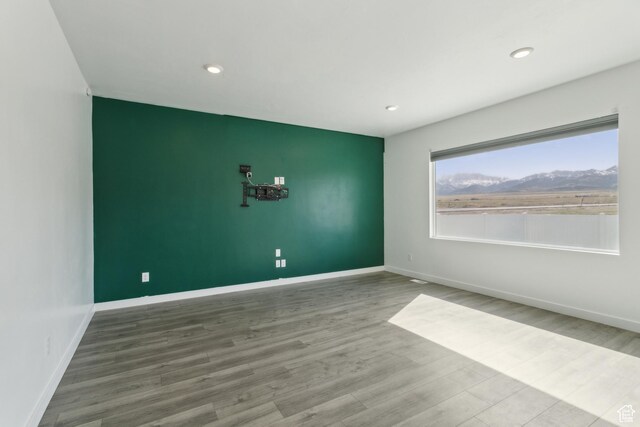13 N N Maraschino Ln, Grantsville, UT 84029 - empty room featuring wood finished floors, baseboards, and recessed lighting