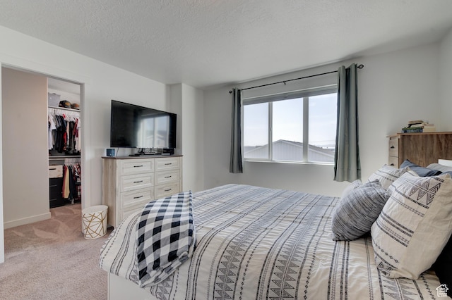 4696 W Talavera Way, Kearns, UT 84118 - bedroom featuring a closet, a spacious closet, light colored carpet, and a textured ceiling