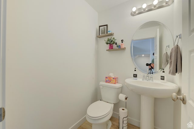 4696 W Talavera Way, Kearns, UT 84118 - bathroom featuring baseboards, a sink, toilet, and wood finished floors