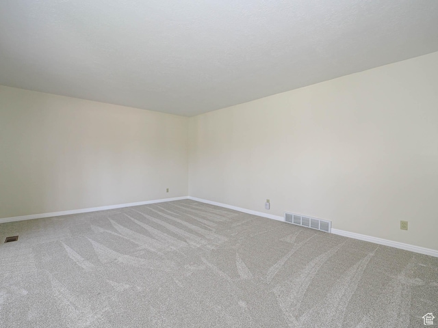 5085 Clover View Dr Unit 11, Murray, UT 84123 - unfurnished room with carpet flooring, visible vents, and baseboards