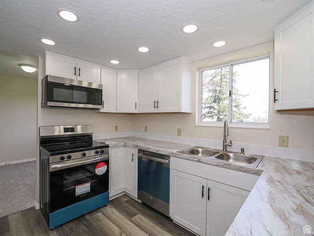 5085 Clover View Dr Unit 11, Murray, UT 84123 - kitchen with dark wood-style flooring, a sink, white cabinets, and stainless steel appliances