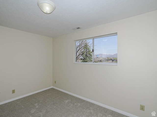 5085 Clover View Dr Unit 11, Murray, UT 84123 - carpeted spare room featuring a textured ceiling, baseboards, and visible vents