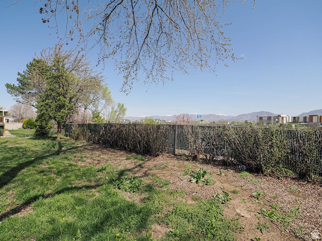 5085 Clover View Dr Unit 11, Murray, UT 84123 - view of yard with a mountain view and a fenced backyard