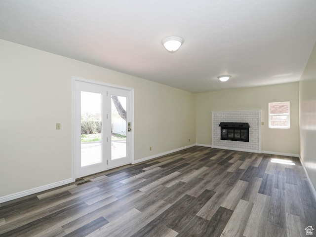 5085 Clover View Dr Unit 11, Murray, UT 84123 - unfurnished living room featuring a fireplace, baseboards, dark wood finished floors, and visible vents