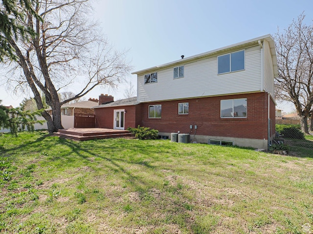 5085 Clover View Dr Unit 11, Murray, UT 84123 - rear view of property with a deck, a yard, fence, cooling unit, and brick siding