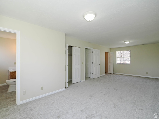 5085 Clover View Dr Unit 11, Murray, UT 84123 - unfurnished bedroom with ensuite bath, baseboards, and carpet