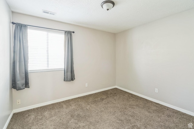 281 W Calias Ln, Stansbury Park, UT 84074 - empty room featuring visible vents, baseboards, carpet floors, and a textured ceiling