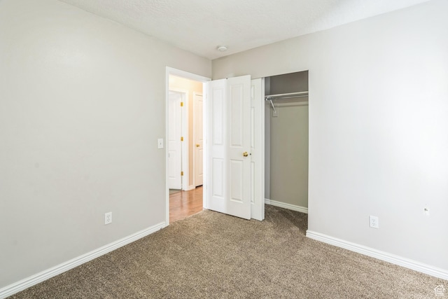 281 W Calias Ln, Stansbury Park, UT 84074 - unfurnished bedroom with a closet, baseboards, and carpet flooring