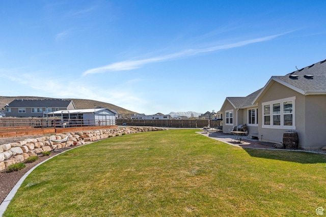 2155 E Blue Sky Dr, Eagle Mountain, UT 84005 - view of yard featuring a patio, a fenced backyard, and a residential view
