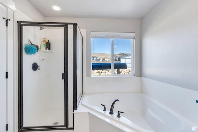 2155 E Blue Sky Dr, Eagle Mountain, UT 84005 - bathroom featuring a bath and a stall shower
