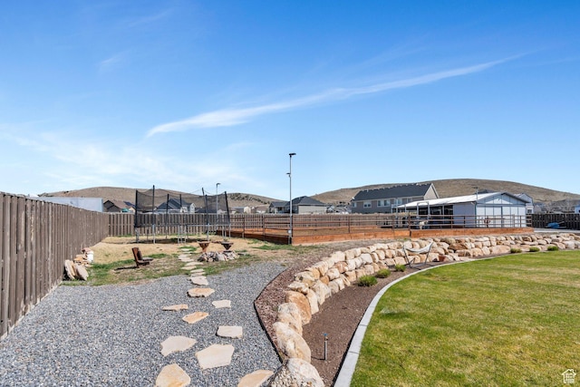 2155 E Blue Sky Dr, Eagle Mountain, UT 84005 - view of yard featuring a trampoline and fence