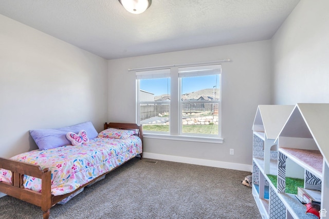 2155 E Blue Sky Dr, Eagle Mountain, UT 84005 - bedroom featuring carpet floors, baseboards, and a textured ceiling