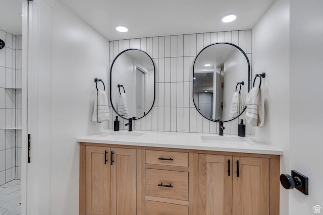 2155 E Blue Sky Dr, Eagle Mountain, UT 84005 - full bathroom featuring double vanity, a tile shower, a sink, and decorative backsplash