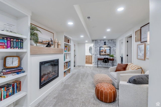 2155 E Blue Sky Dr, Eagle Mountain, UT 84005 - living room featuring a glass covered fireplace, visible vents, recessed lighting, carpet flooring, and baseboards