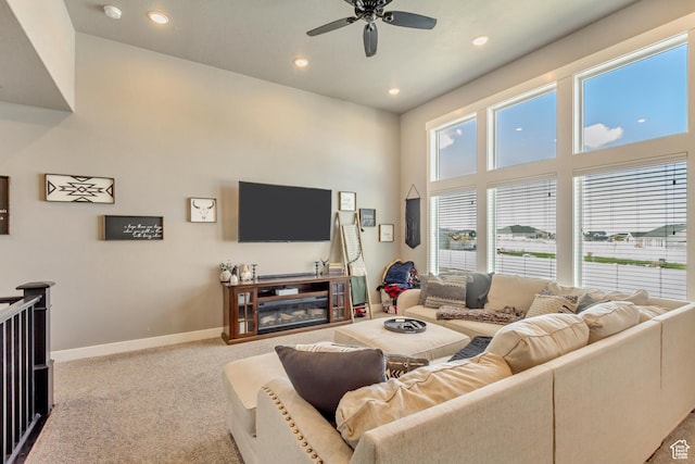 542 W Coyote Ridge Rd Unit 20, Grantsville, UT 84029 - living room featuring carpet, a ceiling fan, recessed lighting, a high ceiling, and baseboards