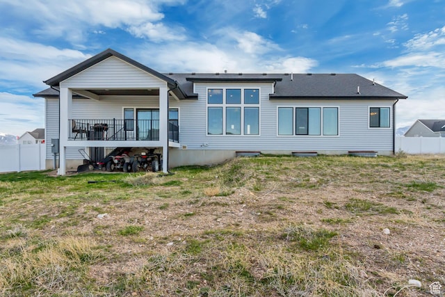 542 W Coyote Ridge Rd Unit 20, Grantsville, UT 84029 - back of house featuring roof with shingles and fence