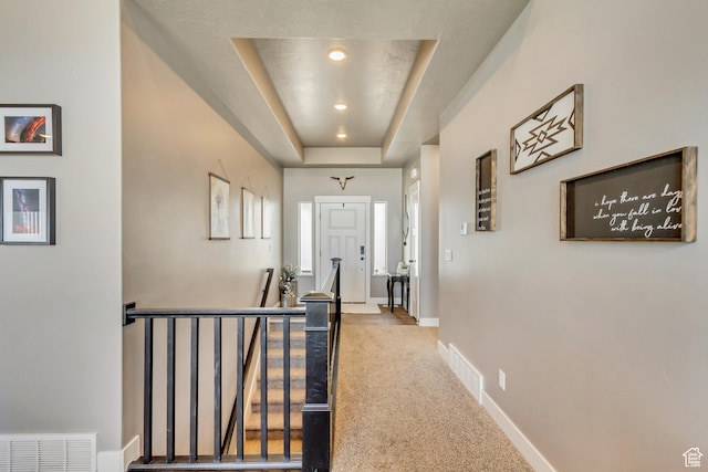 542 W Coyote Ridge Rd Unit 20, Grantsville, UT 84029 - hall featuring visible vents, baseboards, an upstairs landing, and carpet flooring