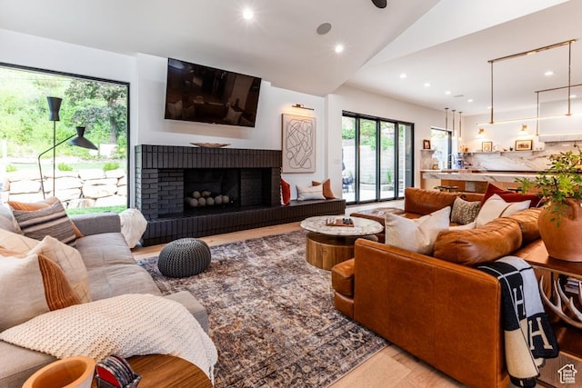 4155 S Parkview Dr, Salt Lake City, UT 84124 - living room featuring recessed lighting, wood finished floors, a fireplace, and lofted ceiling