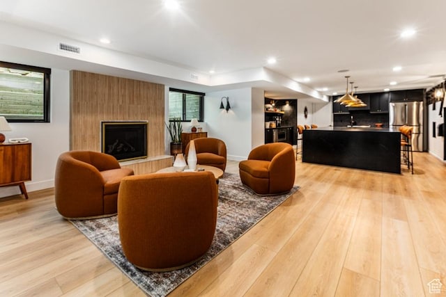 4155 S Parkview Dr, Salt Lake City, UT 84124 - living room with light wood-type flooring, baseboards, a large fireplace, recessed lighting, and visible vents