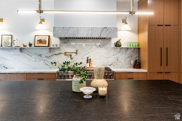 4155 S Parkview Dr, Salt Lake City, UT 84124 - kitchen with wall chimney exhaust hood, stove, brown cabinetry, open shelves, and decorative backsplash