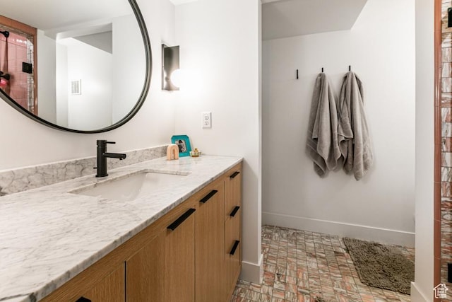4155 S Parkview Dr, Salt Lake City, UT 84124 - bathroom with visible vents, baseboards, brick floor, and vanity
