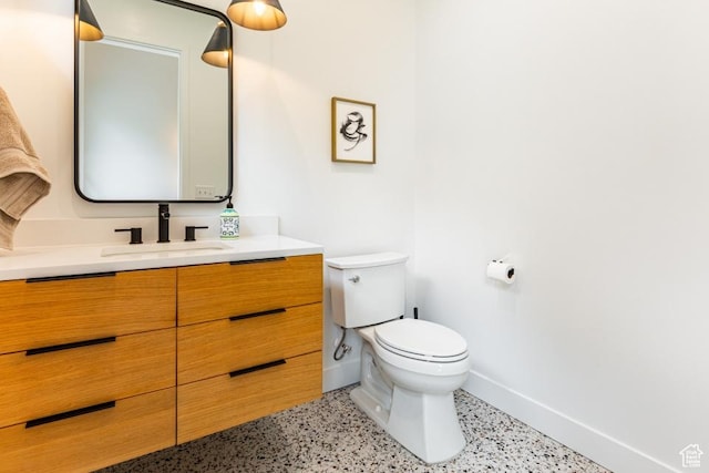 4155 S Parkview Dr, Salt Lake City, UT 84124 - bathroom featuring speckled floor, toilet, vanity, and baseboards