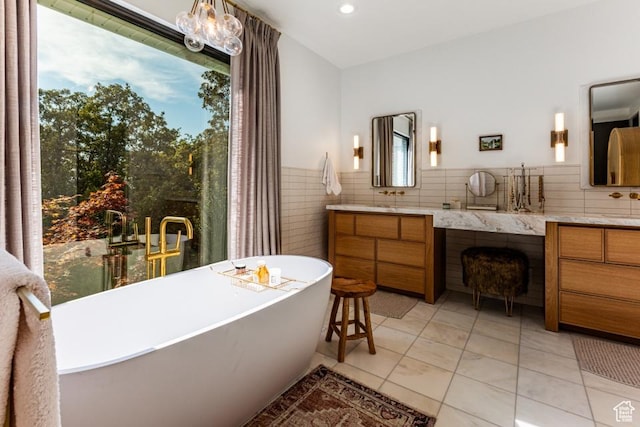 4155 S Parkview Dr, Salt Lake City, UT 84124 - full bathroom with a wealth of natural light, a freestanding tub, and vanity