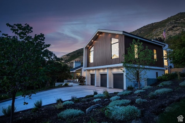 4155 S Parkview Dr, Salt Lake City, UT 84124 - view of property exterior featuring a mountain view, a garage, and concrete driveway